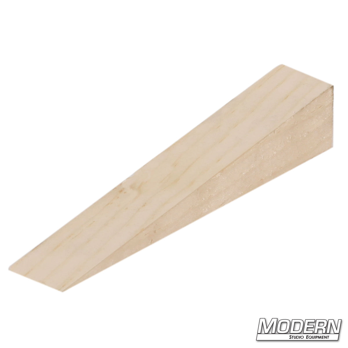 Precision-cut camera wedge for secure leveling and positioning of film and video cameras on uneven surfaces.