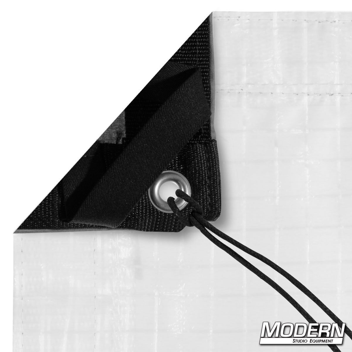 Black and white poly bounce fabric, also known as Griffolyn, used in film and photography to reflect or block light for professional lighting control