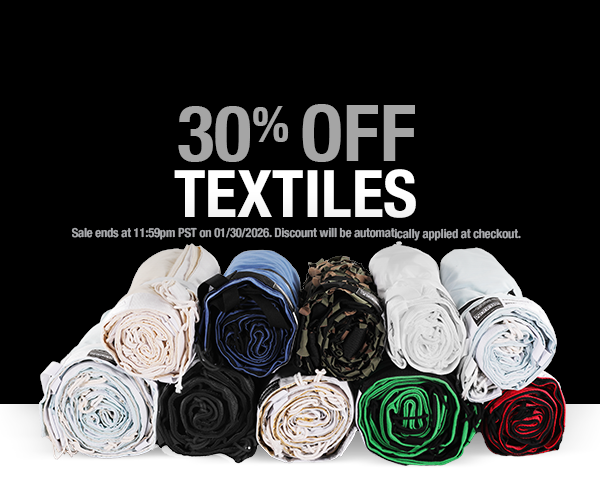 Promotional banner with 30% off textiles text and rolled-up fabrics in various colors on a white background.