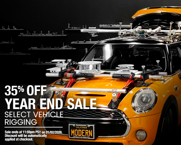 Yellow vehicle with rigging equipment on a dark background, promotional text for year-end sale.