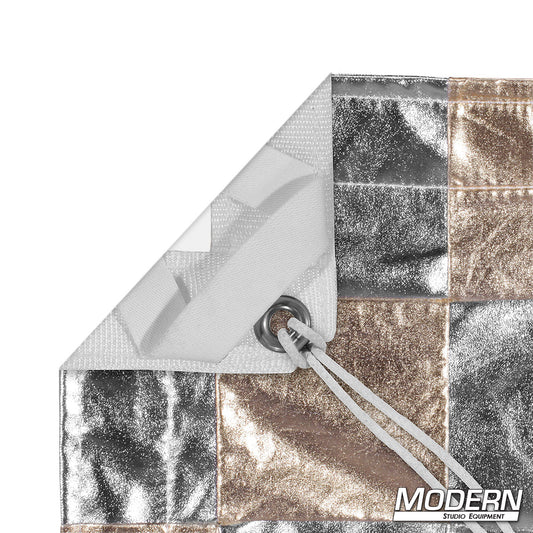 Silver Gold Checker reflective overhead textile with alternating silver and gold reflective panels, reinforced webbing, grommets, elastic corners, and ties for professional film, television, photography, and studio lighting applications.