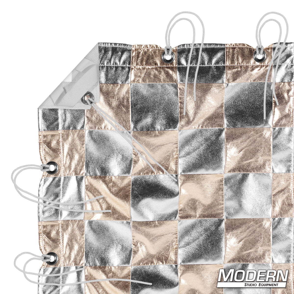 Silver Gold Checker reflective overhead textile with alternating silver and gold reflective panels, reinforced webbing, grommets, elastic corners, and ties for professional film, television, photography, and studio lighting applications