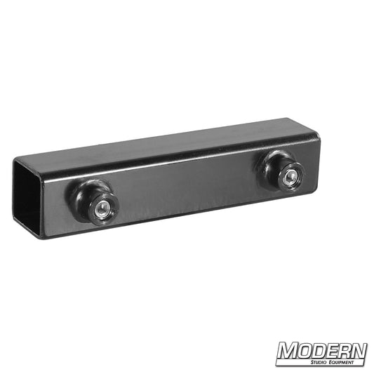 A black metal sleeve designed to fit a 1 inch square tube, featuring a coupler on each end.