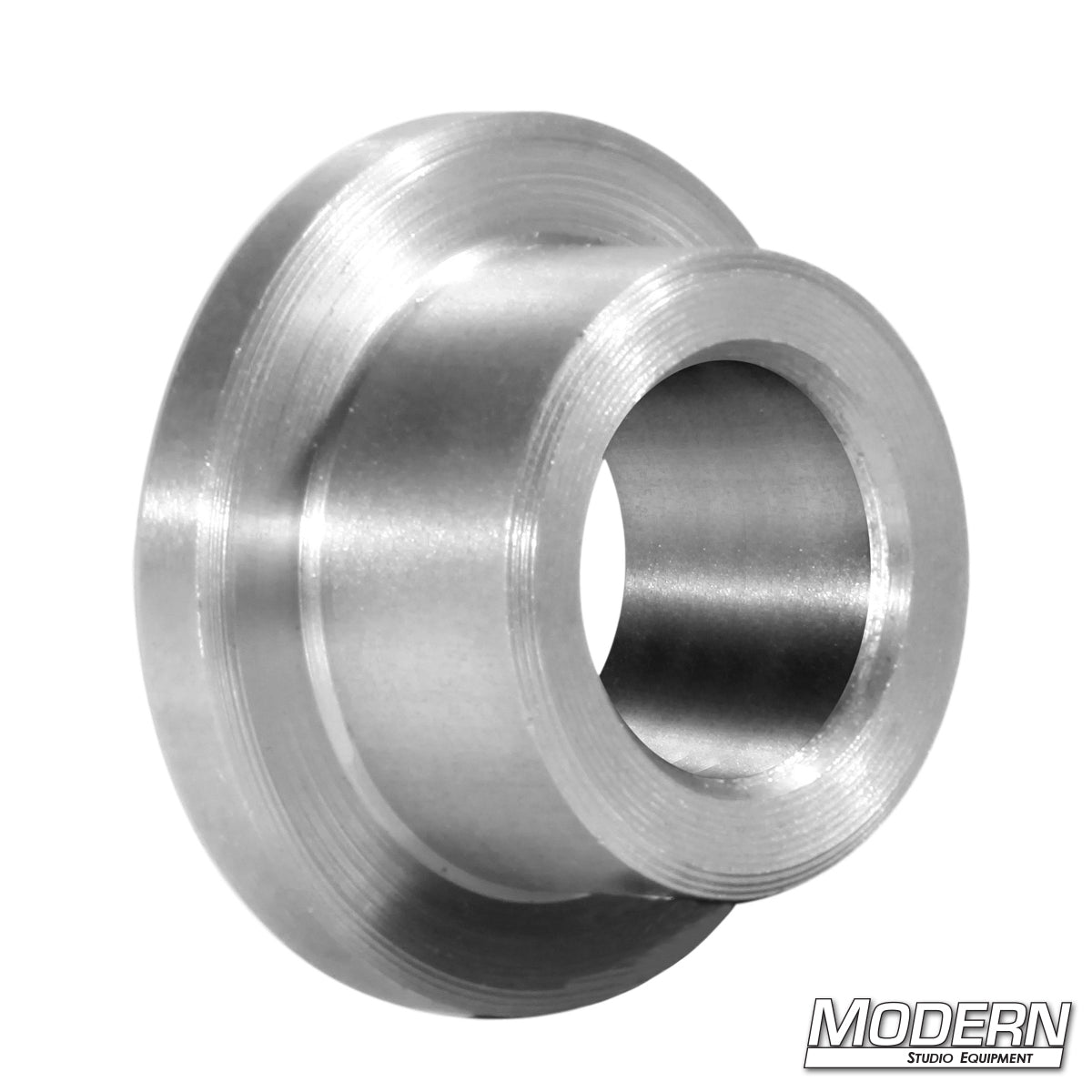 A silver bushing accessory for a skateboard dolly, with the brand name 'Modern' visible on the lower right corner.