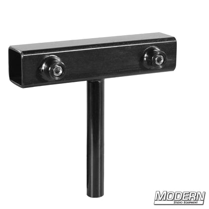 Black steel coupler with 5/8-inch mounting pin and set screws for attaching lighting and grip equipment to 1-inch square tubing.