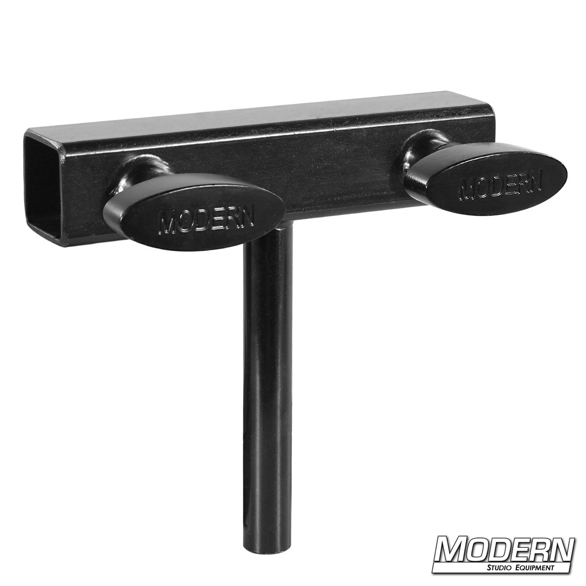Black steel coupler with 5/8-inch mounting pin and set screws for attaching lighting and grip equipment to 1-inch square tubing.