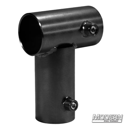 A black metal mini corner fitting used for creating a 90-degree corner on a frame, designed for 1-1/2" schedule 40 aluminum.