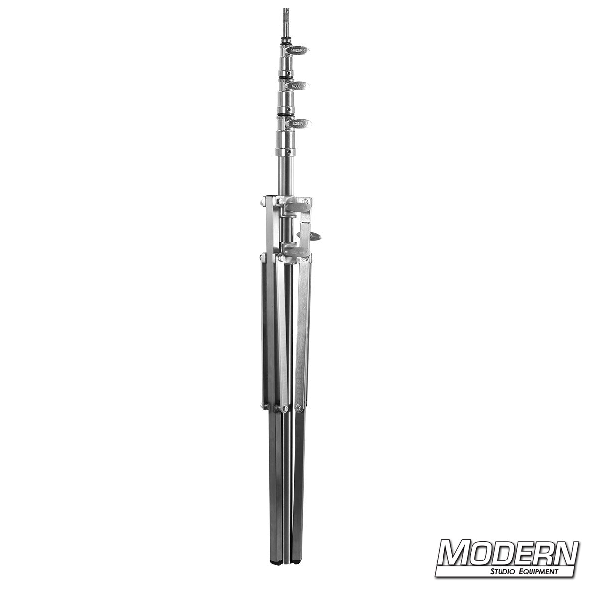 Baby Triple Riser Stand fully extended on set supporting lighting fixture on uneven surface