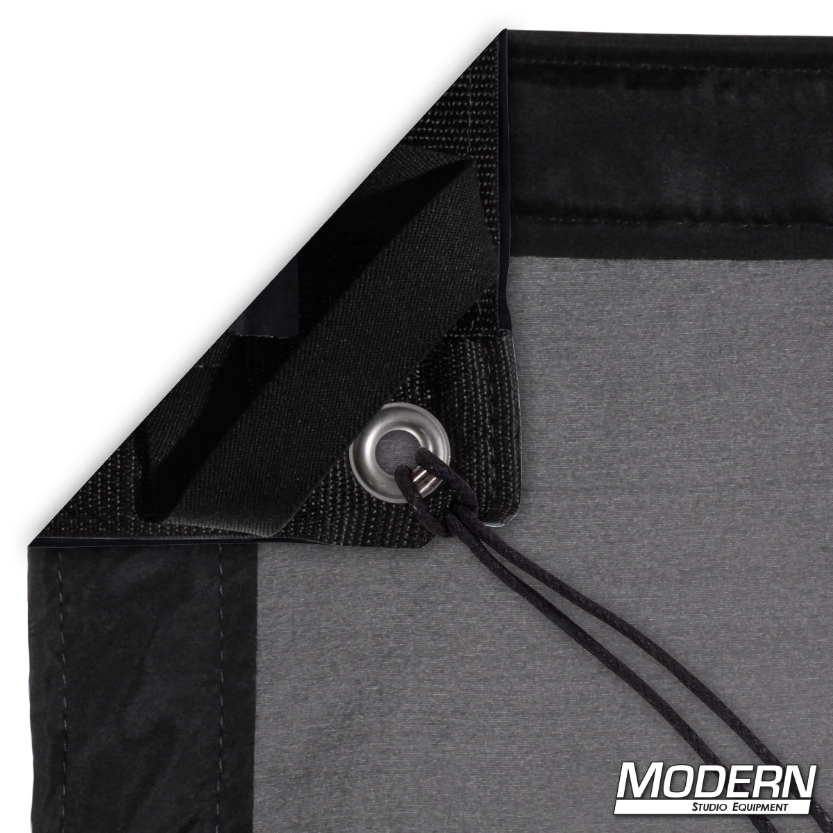 Black China Silk diffusion fabric for soft, even lighting control in professional film, television, and photography production setups.