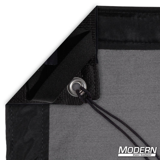 Black China Silk diffusion fabric for soft, even lighting control in professional film, television, and photography production setups.
