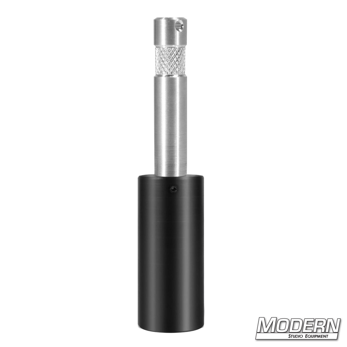 A black paint stick adapter with a silver-colored baby pin attached to it, designed to mount onto a painter pole or stick for use in film set lighting.