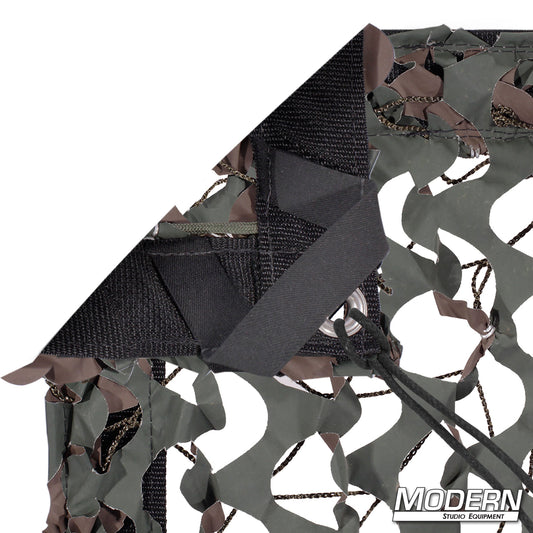 Camo Net slip-on textile with camouflage netting pattern, featuring webbing, grommets, ties, and elastic corners for film production and scenic applications