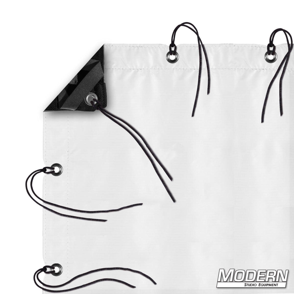 Claycote slip-on textile featuring a matte white bounce surface and black reverse side for negative fill, complete with webbing, grommets, ties, and elastic corners