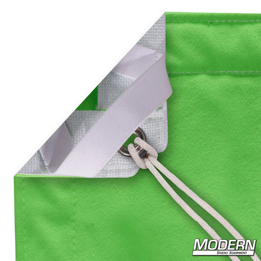 Digital Green Screen slip-on textile for chroma key video production, high-reflectance lime green backdrop with webbing, grommets, ties, and storage bag for film and broadcast studios