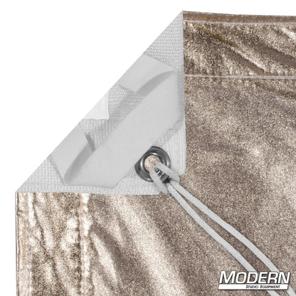 Gold White Lame reflective bounce fabric mounted on frame with warm gold reflective surface for film production, photography, portrait lighting, interviews, and studio lighting control